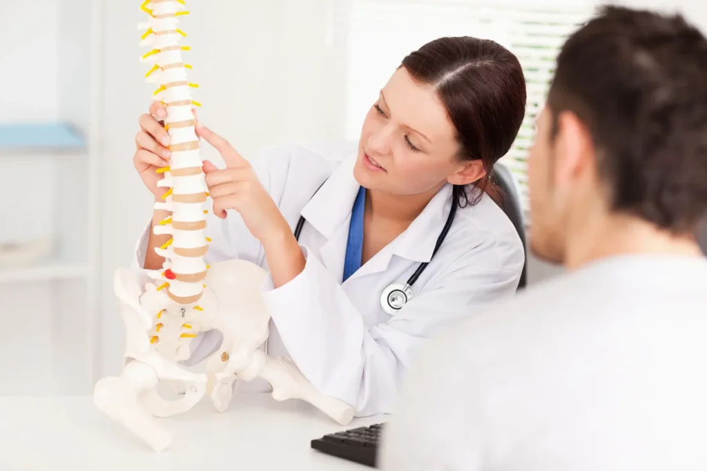 Chiropractor reviewing billing documents